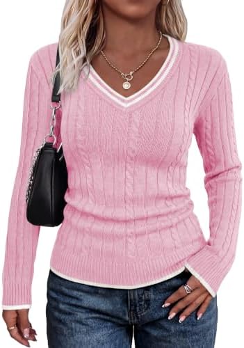 A soft pink cable knit brings fresh color to cooler days, framed by clean white tipping along the edges.