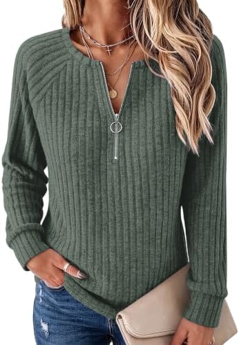 A ribbed quarter-zip pullover in a rich forest green, cut loose through the body with raglan sleeves for easy layering.