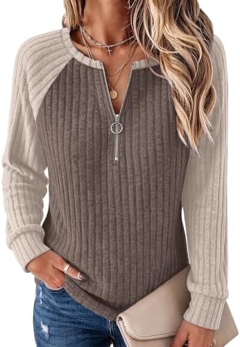 A soft ribbed pullover cut with raglan sleeves, an adjustable quarter zip collar, and a relaxed everyday drape.