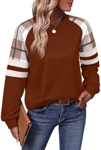 Warm caramel tones meet patterned sleeves on this easy crewneck tunic cut with a curved hem that sits past the hip line.