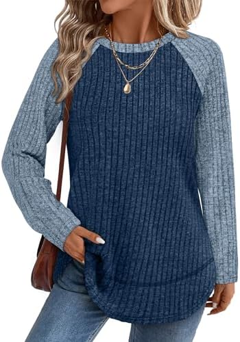 Deep paneled blue navy tones give this soft ribbed tunic top an easy, polished look for crisp evenings and office days.