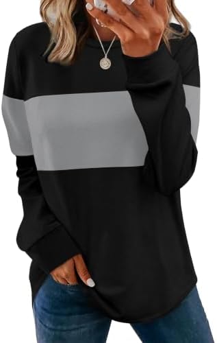A soft crewneck tunic knit with long sleeves, subtle side slits, and a curved hem that pairs easily with leggings.