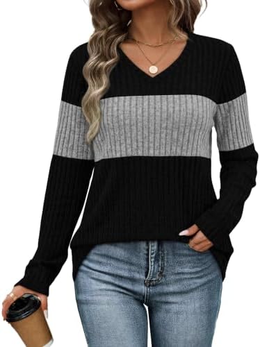 Soft grey knit gets crisp color block panels along the chest and sleeves for a polished office-to-weekend layer.