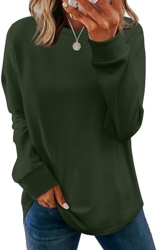 A relaxed green crewneck sweater knit with a tunic-length curved hem and subtle side slits for easy layering over leggings.