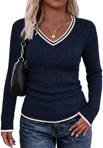 Deep navy knit meets crisp white trim along the neck, cuffs, and hem for an easy, tailored layer on brisk days.