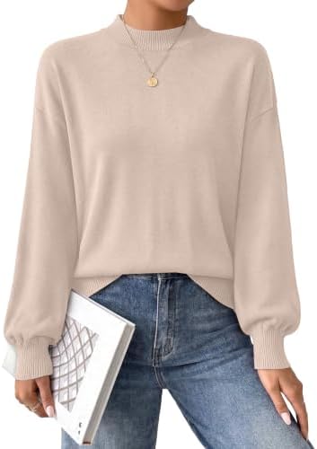 Knitted in a soft apricot shade, this mock neck sweater features gentle puff sleeves and a relaxed body for cool days.