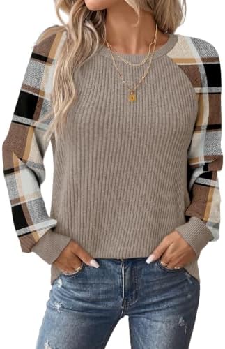 A crisp plaid print joins solid ribbed trim on a lightweight knit that layers cleanly under jackets or cardigans.