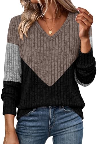 A ribbed color block knit with a gentle V-neckline and a longer tunic hem, cut for an easy drape on cooler days.