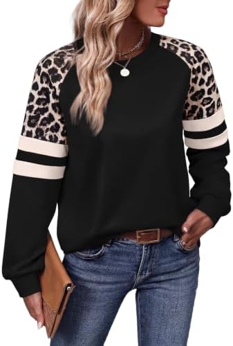 Bold leopard sleeves bring a graphic contrast to this jet-black crewneck tunic, cut long enough to pair easily with leggings.