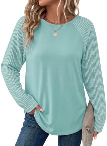 Ribbed raglan sleeves in rich blue green give this lightweight knit tunic an easy drape over leggings for cool evenings.