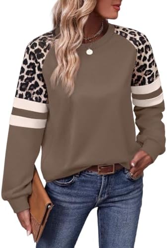 A relaxed crewneck tunic combines a rich coffee brown body with lightweight leopard print sleeves for breezy evenings.