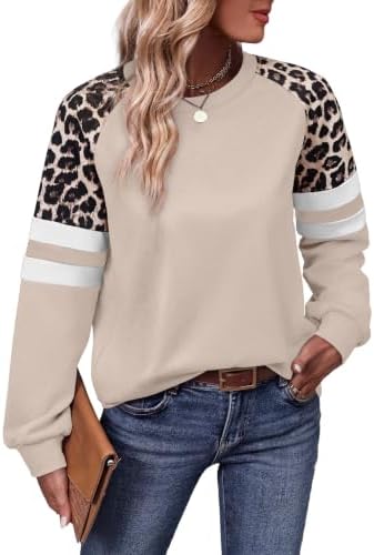 Warm khaki knit meets patterned leopard sleeves in this soft crewneck tunic tailored long enough for leggings.