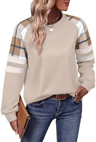 A soft crewneck tunic combines a neutral khaki grid body with contrast printed sleeves for easy daily wear.
