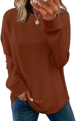 A curved tunic hem in rich caramel knit gives this lightweight long-sleeve crewneck easy coverage over leggings or jeans.