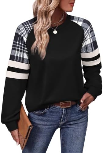 Crisp black and white grid patterning meets contrast sleeves on a relaxed crewneck tunic cut for easy layering on cool days.