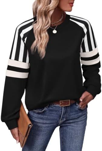 A black striped body meets patterned drop sleeves on this lightweight crewneck tunic cut with extra room through the hips.