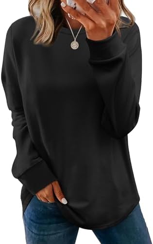 Deep black knit gives this long tunic pullover a clean, solid backdrop for easy layering over jeans or simple leggings.