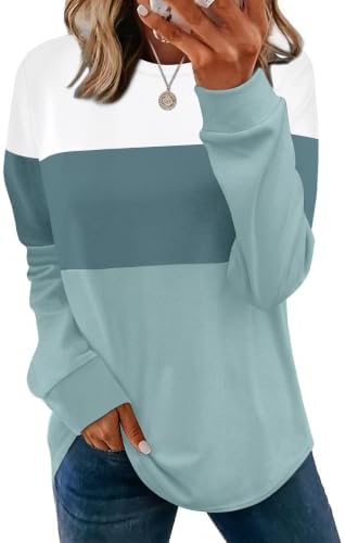 Deep Unique Blue tones set off this lightweight crewneck tunic with side slits and generous hip coverage for cool evenings.