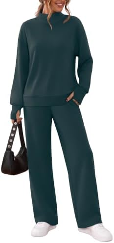 A deep dark green tracksuit cut with a warm mock neck, thumbhole sleeves, and relaxed wide-leg pants for cooler days.