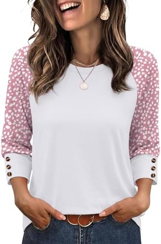 Subtle pink dots break across this breathable knit top, finished with contrast raglan sleeves and three neat accent buttons.