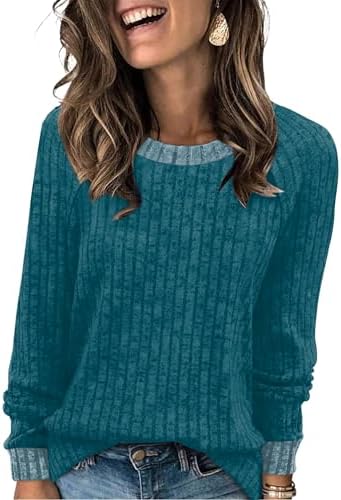 Rich teal blue meets a plush, blanket-soft texture in this loose crewneck top designed for cool mornings and easy layering.