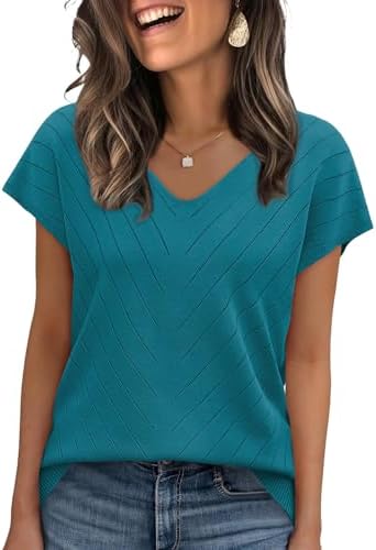 Cool teal blue knit with a gentle V-neck and crochet texture pairs easily with white denim or office trousers.