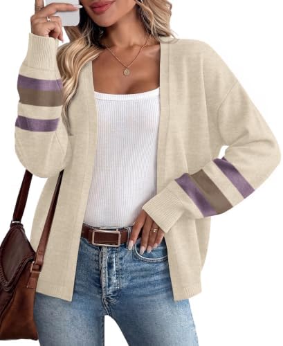 A relaxed beige knit cardigan with striped cuffs and roomy balloon sleeves that slips easily over tanks and summer dresses.