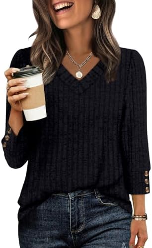 Plush textured knit in solid black gives this three-quarter sleeve tunic a clean, relaxed drape for everyday wear.