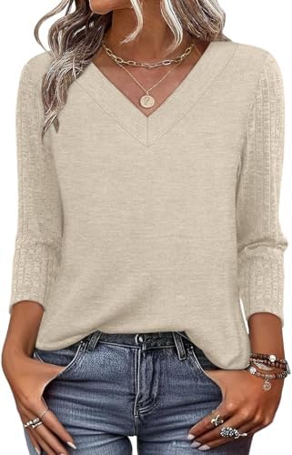 Warm beige sets a calm tone on this soft knit tunic, finished with an open V-neck and easy three-quarter sleeves.