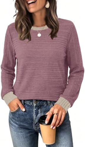 Soft purple and pink color blocks update this relaxed long sleeve top, knit from a lightweight fabric with a plush blanket feel.