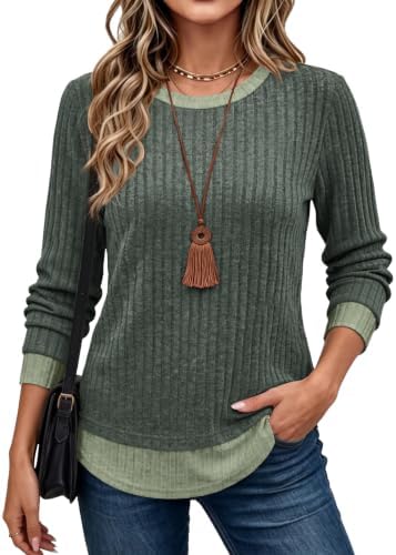 A soft green knit cut with a built-in layered collar and hem gives the look of stacked separates without extra bulk.