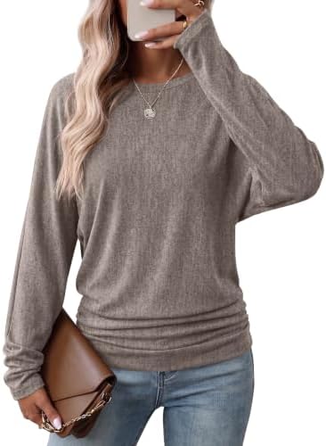 A soft light coffee heathered knit tunic with dolman sleeves and ruched side gathers that sit comfortably at the hip.