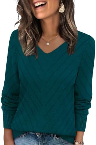 A deep teal v-neck sweater knit with airy crochet detailing and long sleeves for cooler morning strolls.