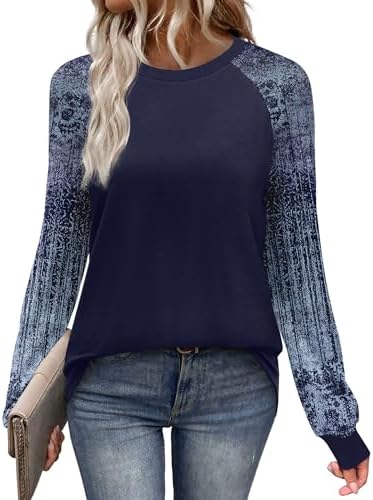 A deep navy backdrop covered in leafy floral motifs gives this raglan long sleeve tee an easy, grounded look for cooler days.