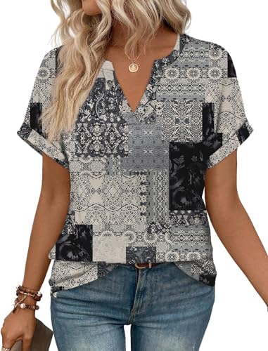 A relaxed V-neck tunic cut in charcoal grey with rolled sleeves and an earthy boho print that pairs with light denim.