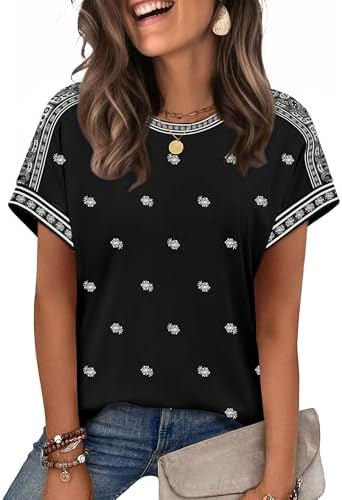 A soft cap-sleeve tee patterned in crisp black print, cut loose enough to tie at the side or tuck into linen shorts.