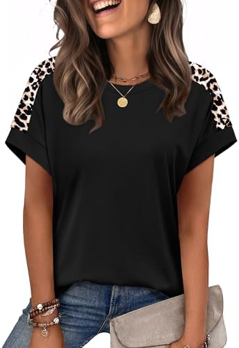 Cap sleeves and solid black knit give this crewneck tee a crisp, neat line you can tuck, leave loose, or tie at the hip.