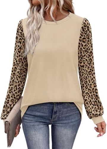 Tonal khaki knit meets leopard print sleeves in a loose tunic cut built for crisp fall days and easy weekend layering.