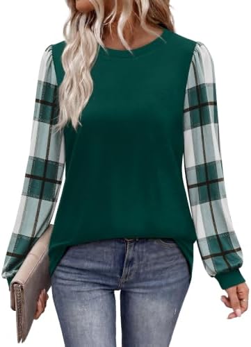 Plaid print long sleeves meet a rich green knit body in this easy tunic length top cut for crisp mornings and layered days.
