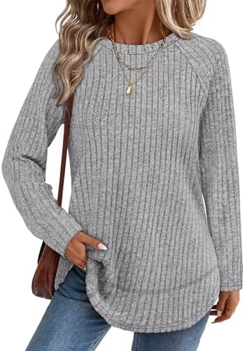 A soft ribbed tunic knit in a heathered grey shade, finished with a curved high-low hem and side slits for easy motion.