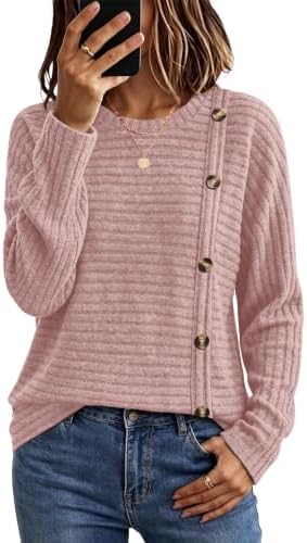 A soft textured knit in dusty pink features decorative chest buttons and a long tunic hem that covers the hips with ease.