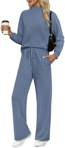 A soft mock neck pullover and wide leg pants in muted grey blue, cut from breathable four-way stretch spacer fabric.