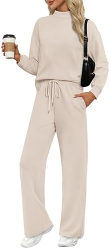 Spun in an airy neutral beige, this two-piece spacer knit set pairs a mock neck long sleeve top with relaxed wide leg trousers.
