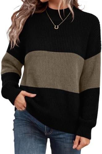 A fuzzy color-block tunic knit in crisp black and warm beige, cut with a relaxed mock neck and an easy longer length.