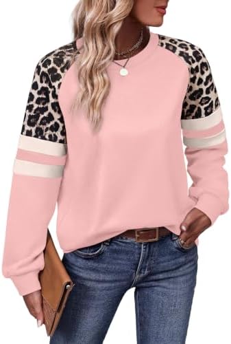 Patterned sleeves in pink leopard add playful contrast to this soft, tunic-length crewneck sweatshirt.