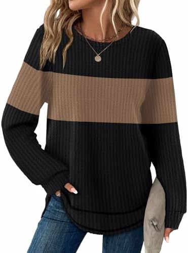 Waffle knit color blocking in rich black and warm brown gives this curved-hem tunic an earthy look for cooler days.