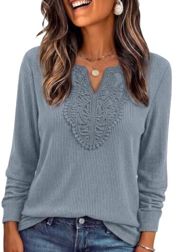 Delicate lace borders the neckline of this light blue ribbed tunic, designed with long sleeves and gentle stretch for cooler days.