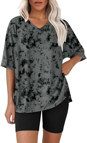 Swirling black tie dye patterns this roomy V-neck tee and stretchy biker shorts set, built for warm-weather lounging.