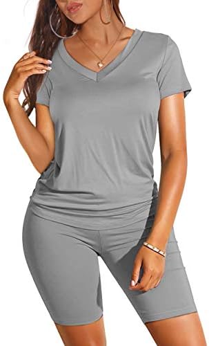 Heather grey knit pairs with white sneakers for an easy two-piece set featuring a loose v-neck tee and fitted biker shorts.