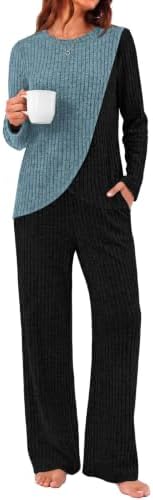 Soft polyester rayon knit pairs with a curved hem top and relaxed matching pants in a rich winter blue hue.